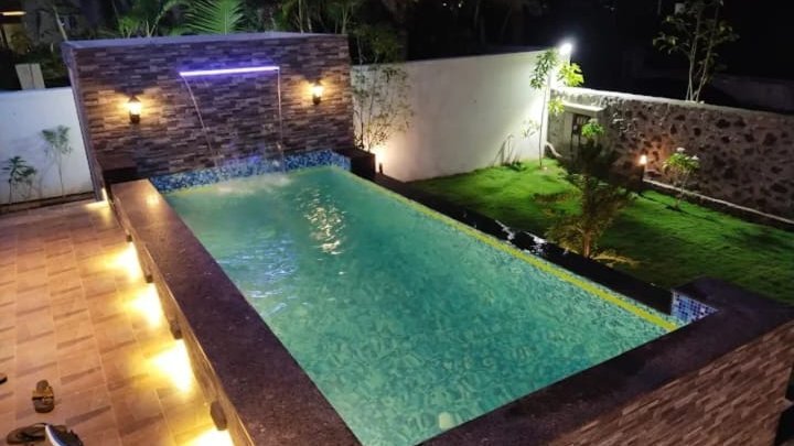 Aerial view of the villa among palm trees